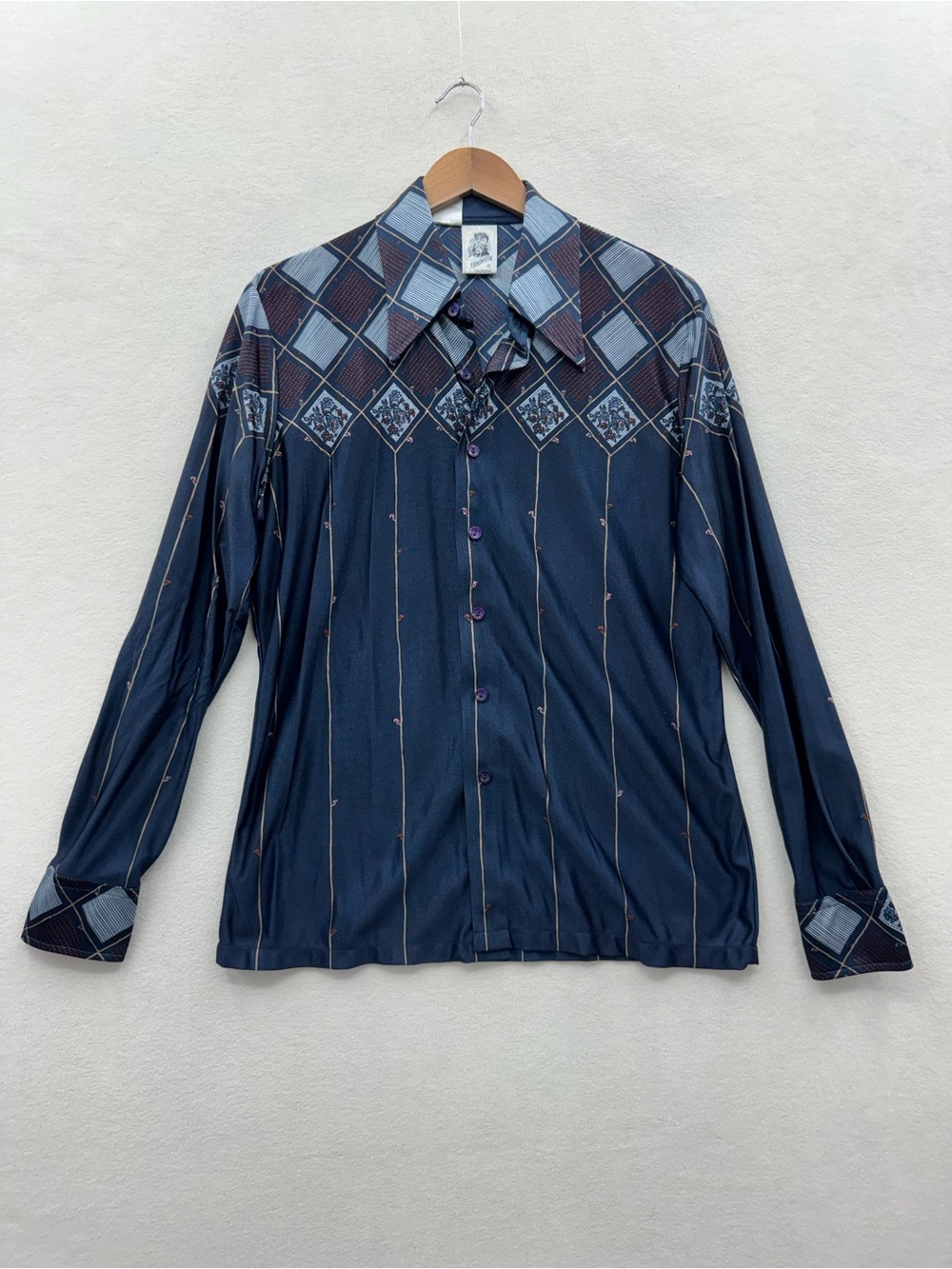 This is a vintage shirt with vintage sizing please see measurements in photos.